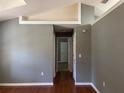 Spacious living room featuring vaulted ceilings, hardwood floors, and neutral walls at 825 Mary Frank Ct, Mount Dora, FL 32757