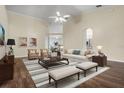 Bright living room featuring high ceilings, modern furniture, and stylish decor, creating an inviting and comfortable space at 8527 Firestone Cir, Clermont, FL 34711