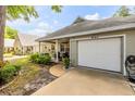 Quaint one-story home featuring a covered front porch and attached one car garage at 8712 Sw 92Nd Pl # D, Ocala, FL 34481