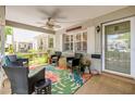 Inviting covered front porch with seating area, ceiling fan, and a welcoming entrance at 8712 Sw 92Nd Pl # D, Ocala, FL 34481