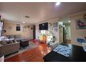 Comfortable living room features tile floors and view to kitchen at 1104 Flamingo Dr, Leesburg, FL 34748
