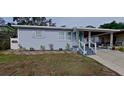 Charming single-story home with a covered carport and a well-maintained front yard at 1224 Lakeview Dr, Clermont, FL 34711