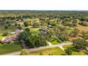 Aerial view of property showing lush greenery, mature trees, with home and surrounding property lines at 15245 Arabian Way, Montverde, FL 34756