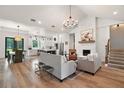 Spacious living room featuring modern furnishings and a cozy fireplace with white brick surround at 1560 Ne 17Th St, Sumterville, FL 33585