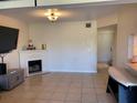 Inviting living room with a decorative fireplace and neutral color palette at 206 Orchid Dr, Davenport, FL 33897