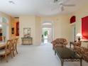 Spacious living room with bright walls, plush carpet, and elegant furniture, creating a cozy and inviting atmosphere at 25243 River Crest Dr, Leesburg, FL 34748