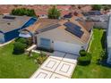 Lovely home with solar panels nestled in a neighborhood of homes with manicured lawns at 735 Palma Dr, The Villages, FL 32159