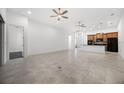 Spacious living room features tile floors and an open-concept kitchen at 780 Mystic Hill Ct, Kissimmee, FL 34759