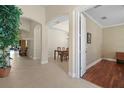Open entryway with arched doorways, tiled floors, and views into the dining room and office at 926 Wood Briar Loop, Sanford, FL 32771