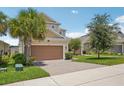 Charming two-story home featuring a three-car garage, well-maintained lawn, and inviting curb appeal at 1539 Osprey View Dr, Apopka, FL 32703