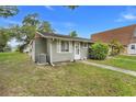Cozy home with neutral siding, well-kept lawn, and a visible AC unit, offering modern comfort at 10301 Us Highway 27 # 187, Clermont, FL 34711