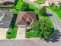 Aerial view of a single-story home showcasing its well-maintained landscaping and neighborhood at 10986 Se 171St Street Rd, Summerfield, FL 34491