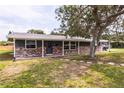 Attractive single-story home with brick accents, covered entry, and lush lawn, perfect for curb appeal at 110 River Beach Dr, Ormond Beach, FL 32176