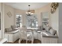 Cozy breakfast nook with a built-in banquette seating area surrounded by windows at 1226 Overlook Rd, Eustis, FL 32726
