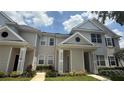 Charming two-story townhome with neutral siding, well-kept landscaping, and inviting entrance at 130 Southern Pecan Cir # 204, Winter Garden, FL 34787