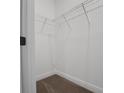 A well-organized closet featuring wire shelving and neutral carpeting at 14261 Crest Palm Ave, Windermere, FL 34786