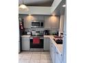 Modern kitchen featuring stainless steel appliances and ample counter space at 3306 Sandy Shore Ln, Kissimmee, FL 34743