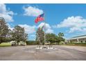 This community gathering place features a golf course and an American flag at 33417 Pennbrooke Pkwy, Leesburg, FL 34748