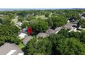 The home resides in a neighborhood with lush landscaping and a nearby golf course at 3718 Westerham Dr, Clermont, FL 34711