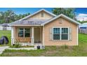 Attractive single-story home featuring a welcoming entrance and well-maintained front yard in a quiet neighborhood at 6710 Winkles St, Coleman, FL 33521