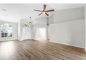 Open-concept living room filled with natural light, showcasing a modern design and beautiful flooring at 12838 Owasso Ln, Clermont, FL 34711