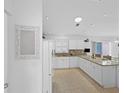 Well-lit kitchen featuring modern appliances and granite countertops at 1963 Ladyfish Ave, The Villages, FL 32162