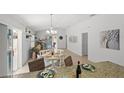Bright living room with sliding glass doors, dining area, and stylish decor at 1963 Ladyfish Ave, The Villages, FL 32162