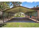 Large carport area with ample space for parking, featuring scenic water views at 31941 Tropical Shores Dr, Tavares, FL 32778
