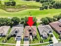 Aerial view of a single-Gathering home on a golf course with a mature landscaped yard and a screened-in pool at 3519 Arlington Ridge Blvd, Leesburg, FL 34748