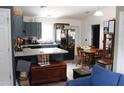 Cozy kitchen featuring modern appliances, granite countertops, and adjacent dining area at 41 Dogwood Loop, Ocala, FL 34472