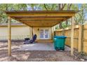 Outdoor patio with wooden roof, offers a shaded retreat for outdoor enjoyment and entertaining at 43 Almond Pass Dr, Ocala, FL 34472