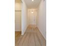 Inviting hallway with carpet flooring leading to the front door, creating a warm and welcoming ambiance at 532 Silver Palm Dr, Haines City, FL 33844