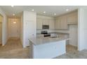 Modern kitchen with stainless steel appliances, granite countertops, and an island perfect for entertaining at 532 Silver Palm Dr, Haines City, FL 33844