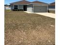 Pleasant single-story home with a neatly kept lawn and a convenient two-car garage, offering both comfort and functionality at 5547 Se 91St Pl, Ocala, FL 34480