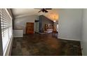 Open-concept living room with tile flooring and ample natural light at 901 Baylor Dr, Deltona, FL 32725