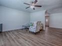 Open living area with light wood flooring and neutral decor with an arched room divider at 9144 Sw 156Th Pl, Dunnellon, FL 34432
