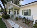 Charming home featuring a cozy front porch, manicured landscaping, and a welcoming entrance at 1339 Orchid Ave, Winter Park, FL 32789
