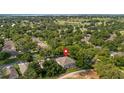 Aerial view of the property showcasing the screened-in pool, mature trees, and surrounding neighborhood near the golf course at 3607 Fairfield Dr, Clermont, FL 34711