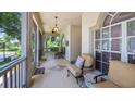 Inviting front porch featuring comfortable seating, a ceiling fan, and views of the manicured neighborhood at 3607 Fairfield Dr, Clermont, FL 34711