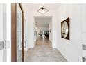Bright foyer featuring tile flooring and an open view to the living spaces at 3769 Causey Ct, The Villages, FL 32163