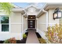The front entrance featuring a beautifully landscaped walkway at 3769 Causey Ct, The Villages, FL 32163