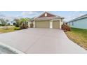 Beautiful single-story home featuring a wide driveway and well-kept landscaping at 3769 Causey Ct, The Villages, FL 32163