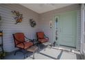 Cozy front porch with comfortable seating, creating a welcoming entrance at 3817 Miragalia Ln, The Villages, FL 32163