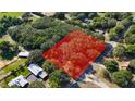 Aerial view of property showing a large, wooded lot with ample privacy and mature trees at 3930 Griffin Ave, Lady Lake, FL 32159