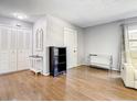 Bright living room featuring hardwood floors, modern decor, and ample closet space at 500 Newell Hill Rd # 113D, Leesburg, FL 34748