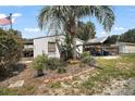 Backyard shed and carport featuring landscaping at 13137 Kansas Ave, Astatula, FL 34705