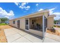 The enclosed patio provides a great spot to relax and enjoy the outdoor views and sunshine at 2805 Burgos Dr, The Villages, FL 32162