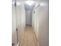 Hallway view with multiple doors and closet providing easy access to rooms and storage at 48 Pinehurst Cir, Ormond Beach, FL 32174