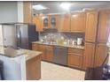 Eat-in kitchen features stainless appliances, granite countertops and plenty of cabinet space at 48 Pinehurst Cir, Ormond Beach, FL 32174