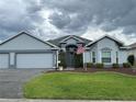 Inviting single-story home featuring a well-kept lawn, and neutral exterior paint at 1706 Augustine Dr, The Villages, FL 32159